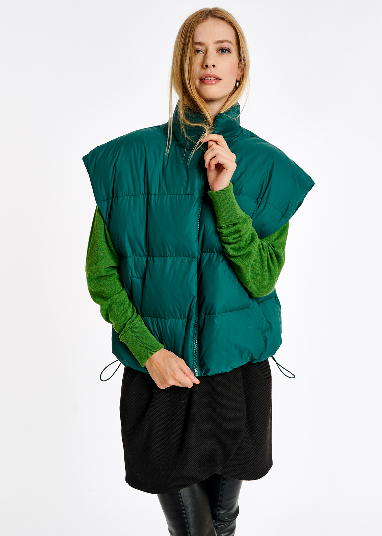 green sleeveless jacket