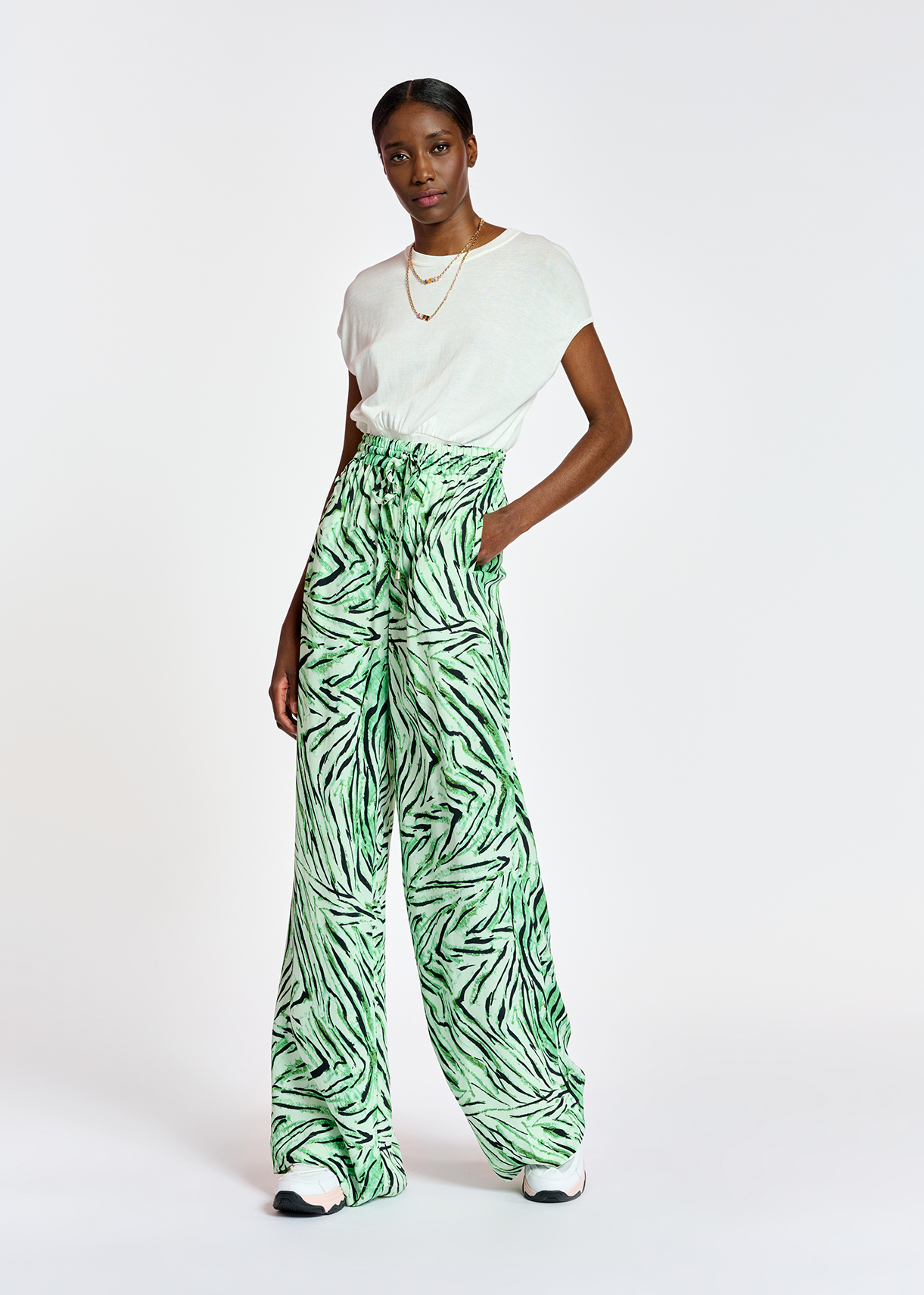 Mint green wide-leg pants with tiger 